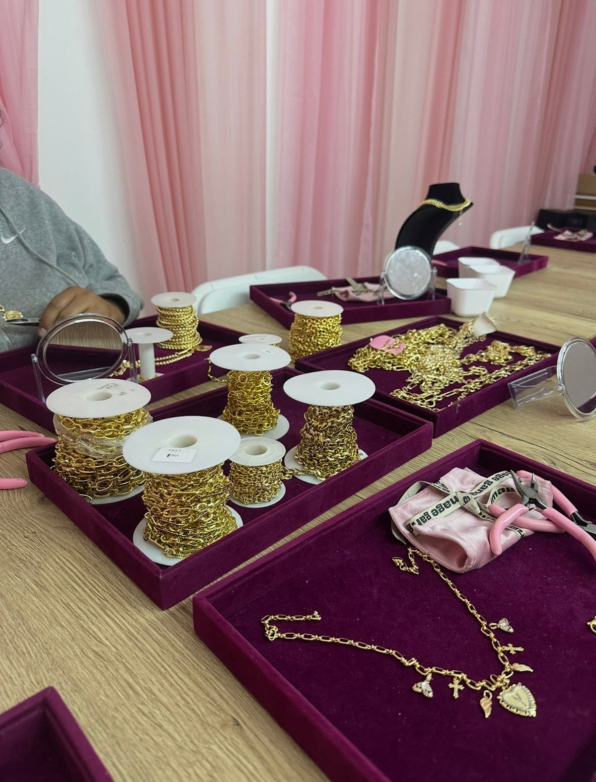 Gold chains laid out on the workshop table